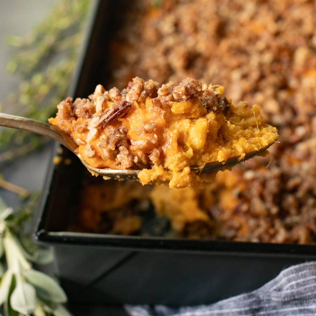 a large serving spoon with sweet potato casserole