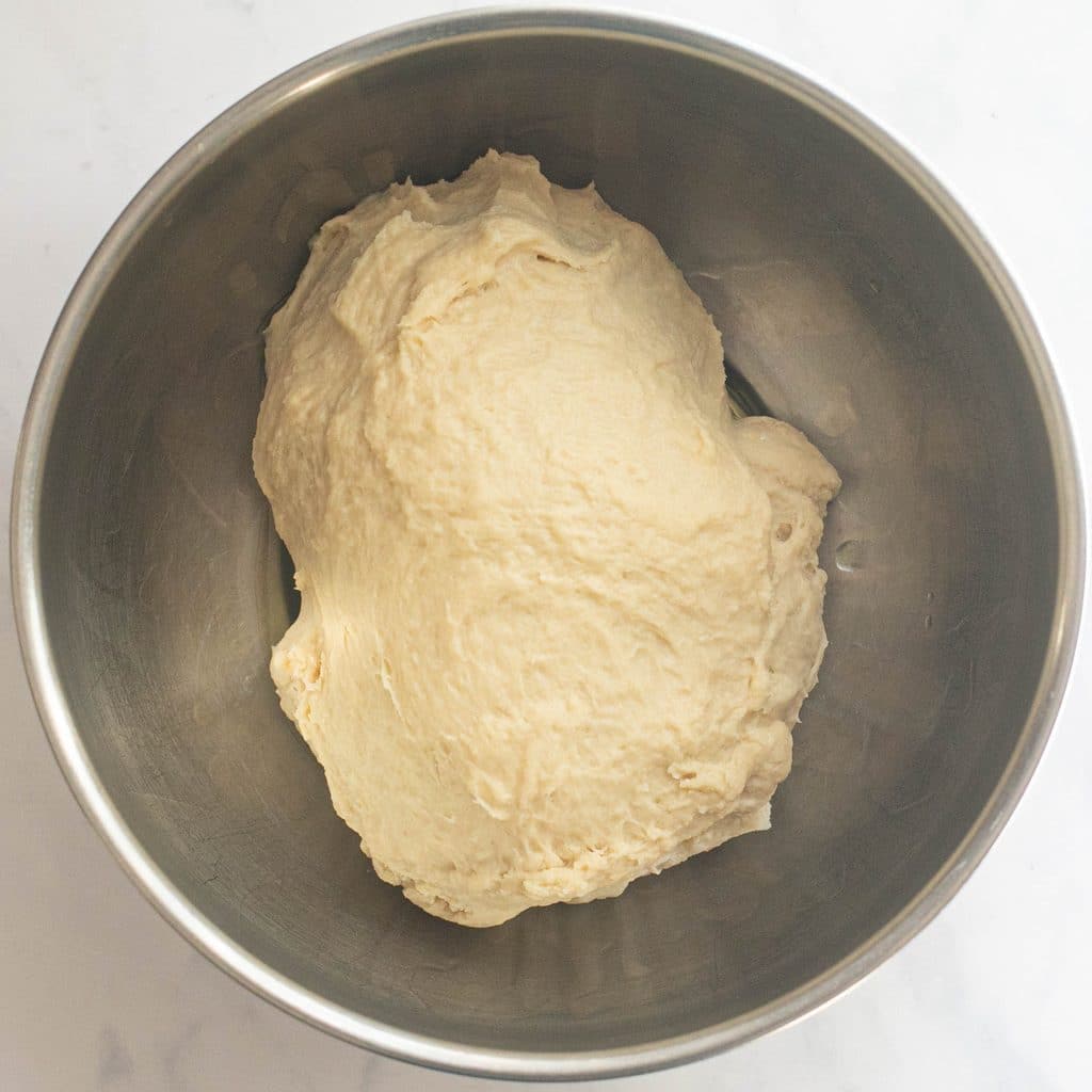 bread dough in a bowl before rising